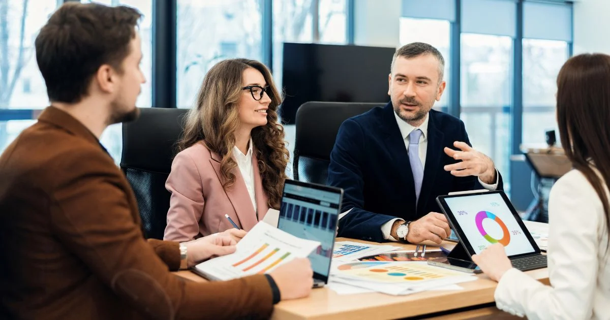 Project management team reviewing analytics data